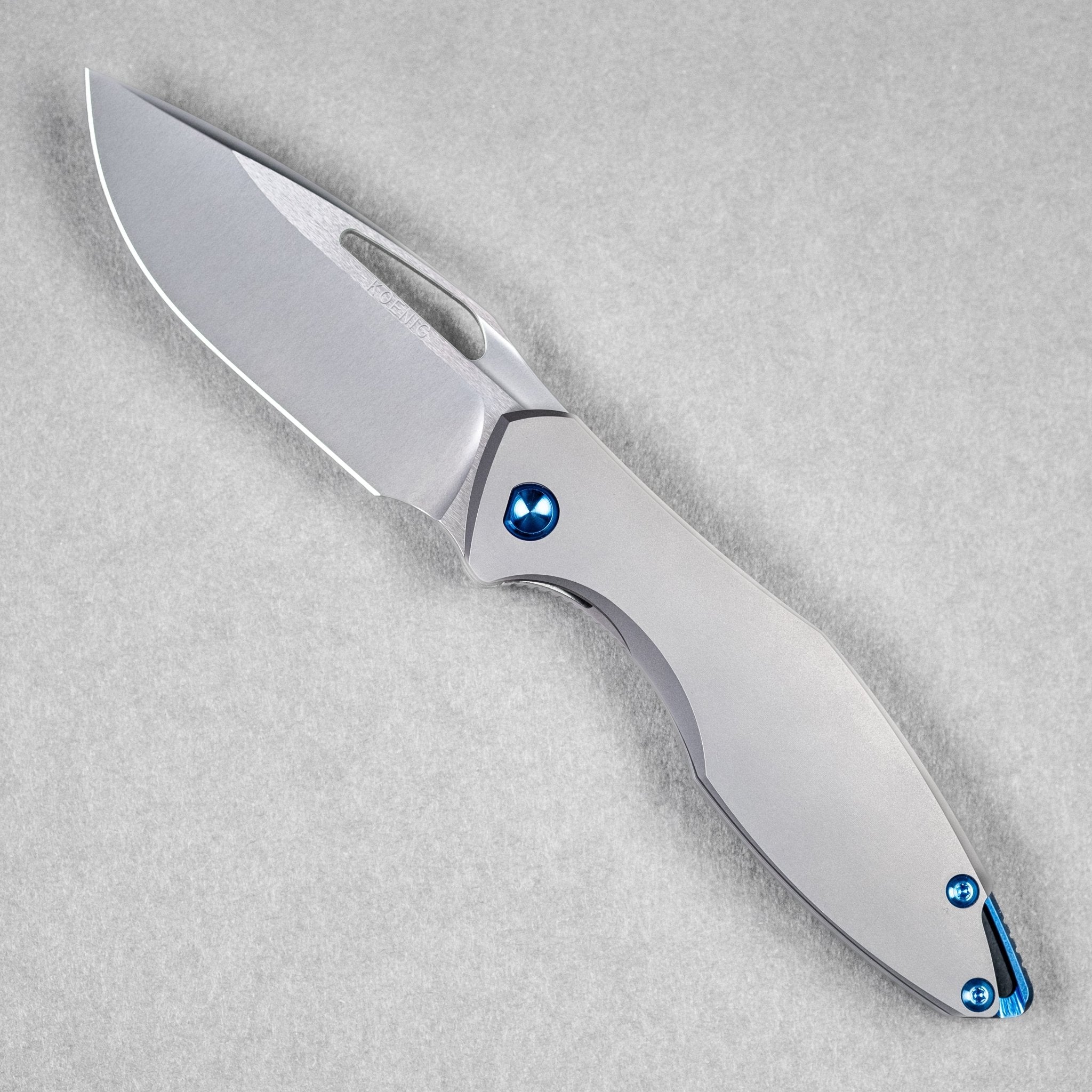Koenig Arius - Non-Flipper w/ Blue Anodized Ti Hardware