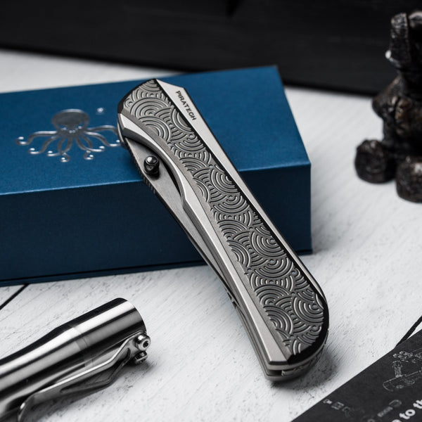Drop Date (04/15): Piratech x URBAN Saga - Satin DLC S90V & Zir Blasted Titanium w/ Bead Blast DLC Chaos Seigaiha™ - URBAN EDC®