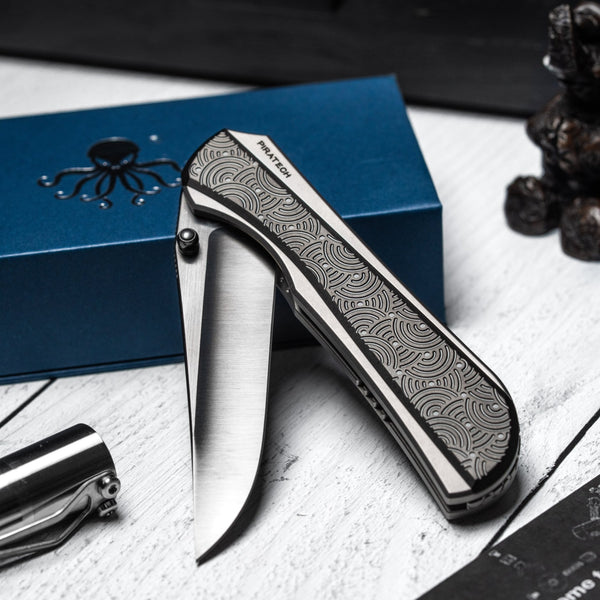 Drop Date (04/15): Piratech x URBAN Saga - Satin DLC S90V & Zir Blasted Titanium w/ Bead Blast DLC Chaos Seigaiha™ - URBAN EDC®